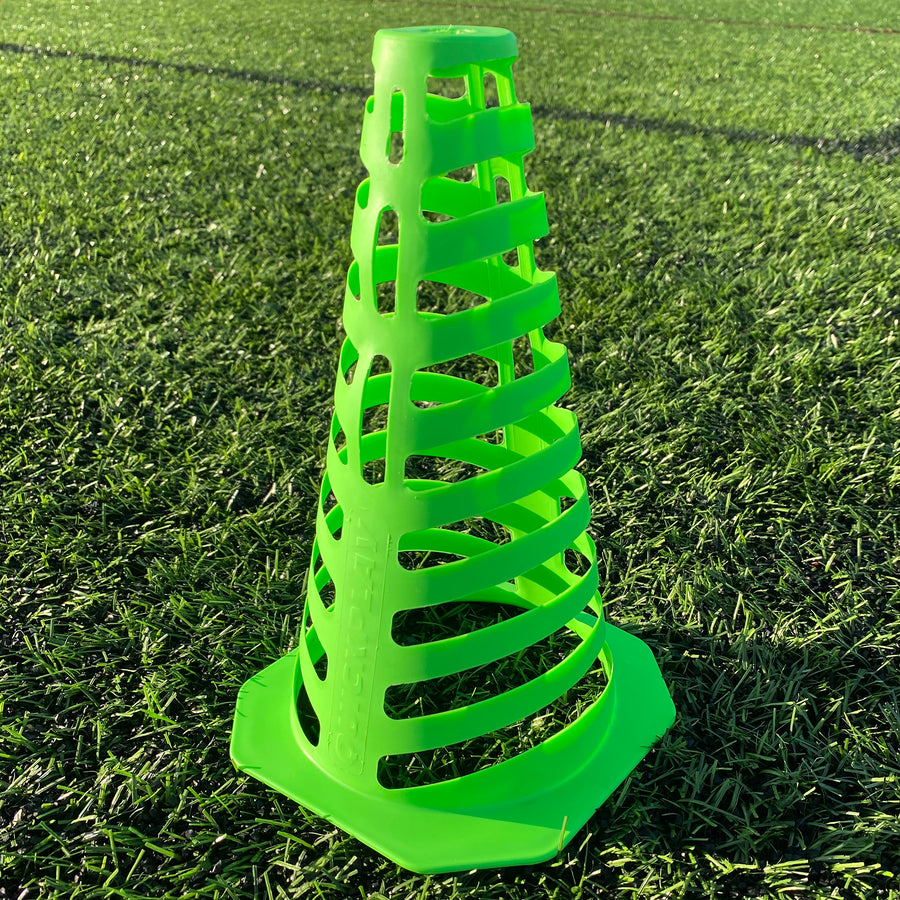 Single green 9" collapsible cone with slotted sides standing on artificial grass.