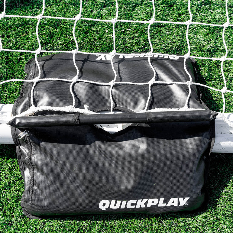 Black Quickplay sandbag on a goal that is on grass