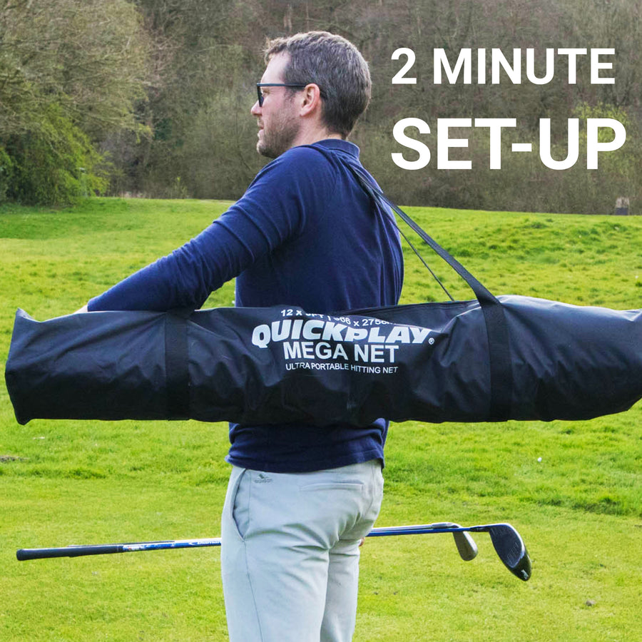 Man carrying the MEGA NET Golf Hitting Net 12x9' in its black QUICKPLAY MEGA NET bag across his shoulders on grass.