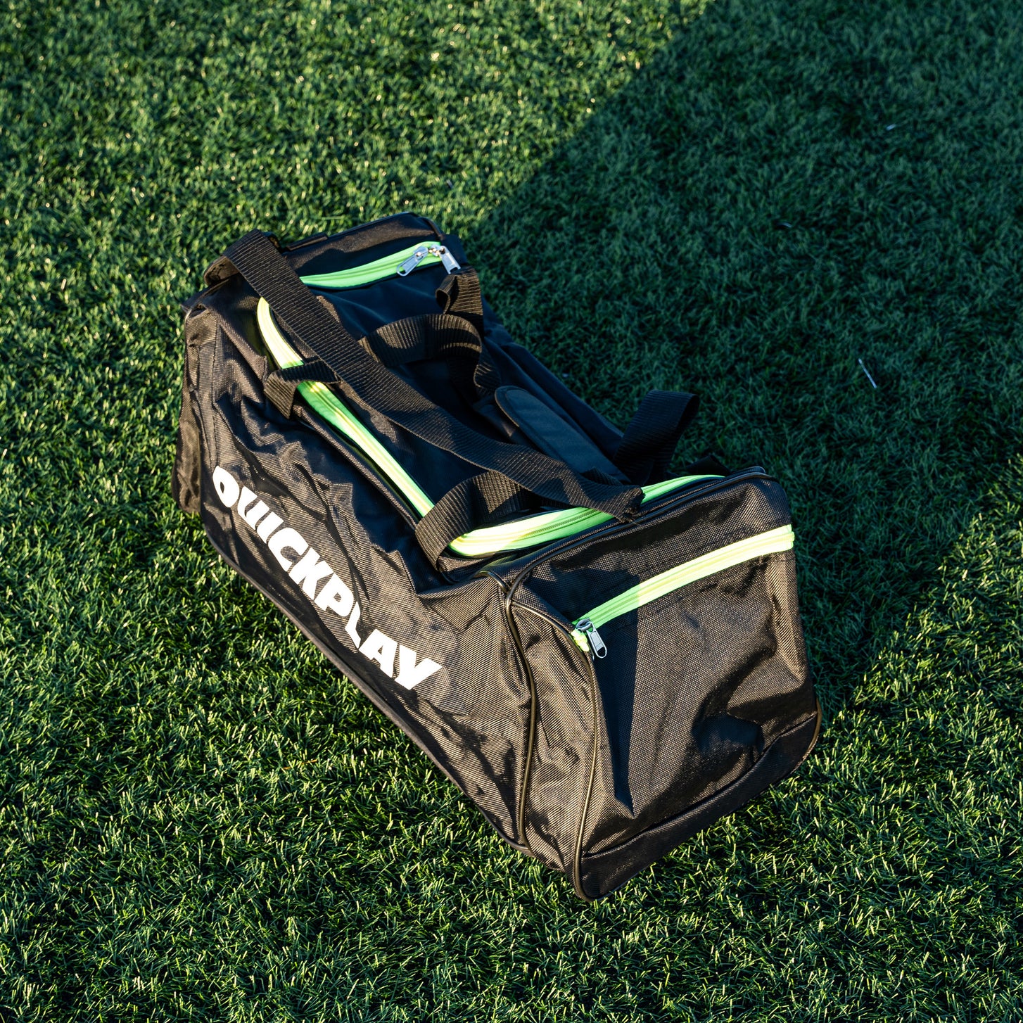 QUICKPLAY Equipment & Kit Bag (M) from above at an angle, showing the top zip, end pocket and straps.