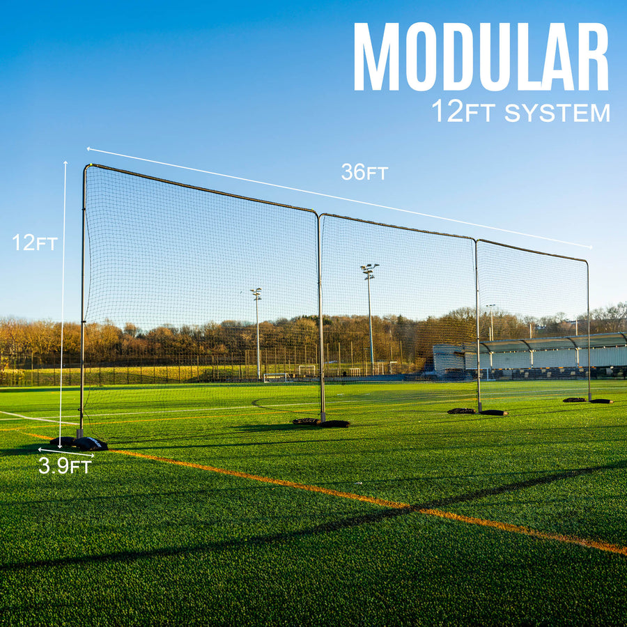 Modular 12ft barrier net system on a sports field with clear blue sky