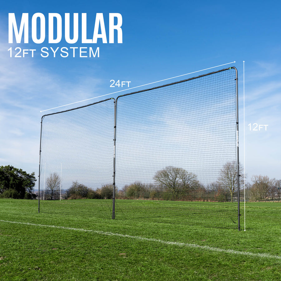 Modular 12ft barrier net system on a grassy field with clear sky