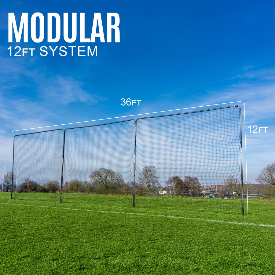 Modular 12ft barrier net system on a grass field with clear sky