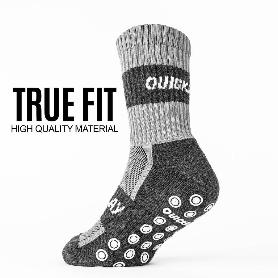 Single grey QUICKPLAY Grip Sock from the side, showing the mesh panel and sole grips, with the text "True fit".