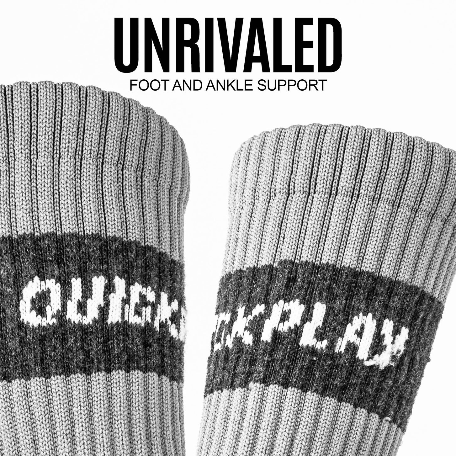 Close-up of the ribbed grey cuffs and logo bands of two QUICKPLAY Grip Socks, with the text "Foot and ankle support".