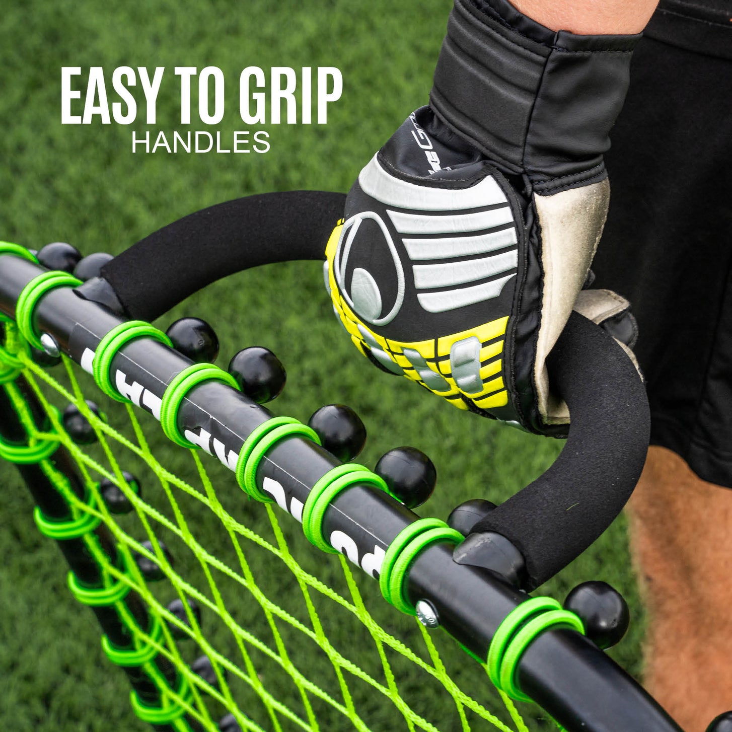 Goalkeeper's gloved hand holding a curved Handheld Rebounder handle, with the text "Easy to grip handles".