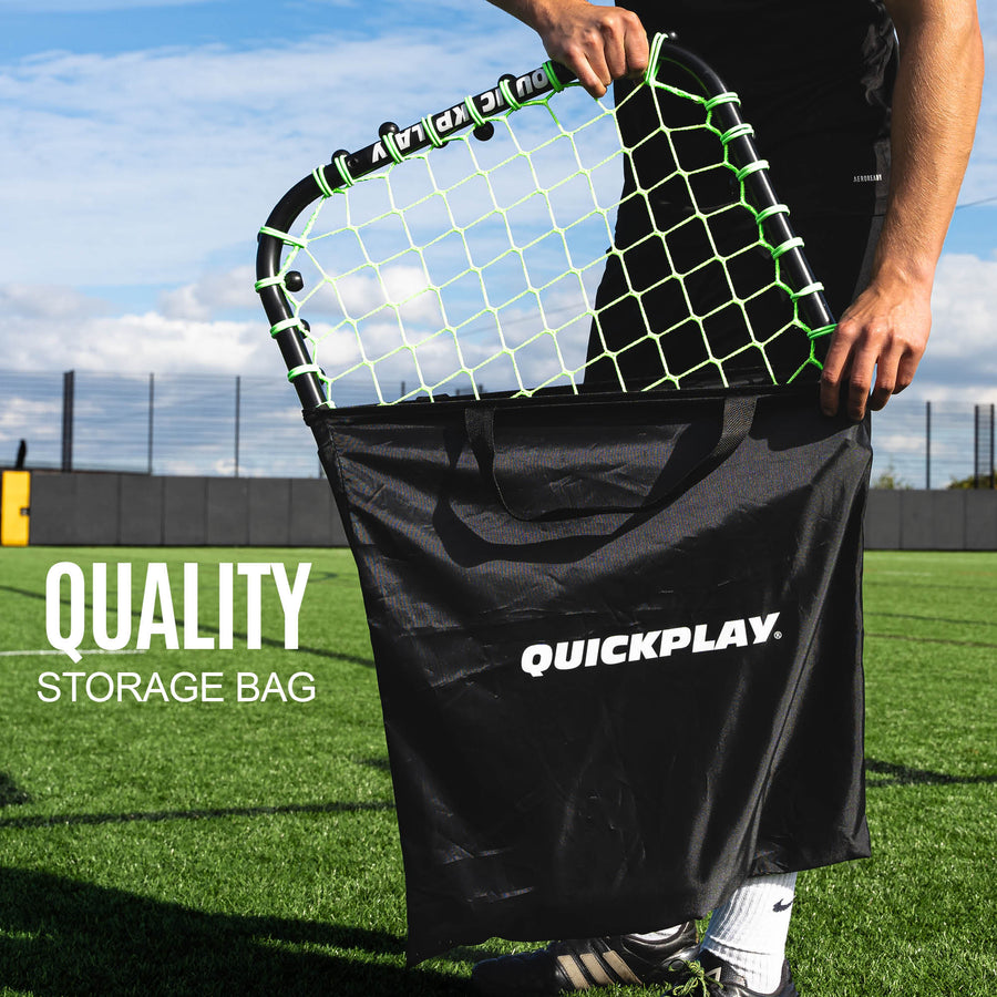 Player sliding the Handheld Rebounder into a black QUICKPLAY bag on a pitch, with the text "Quality storage bag".