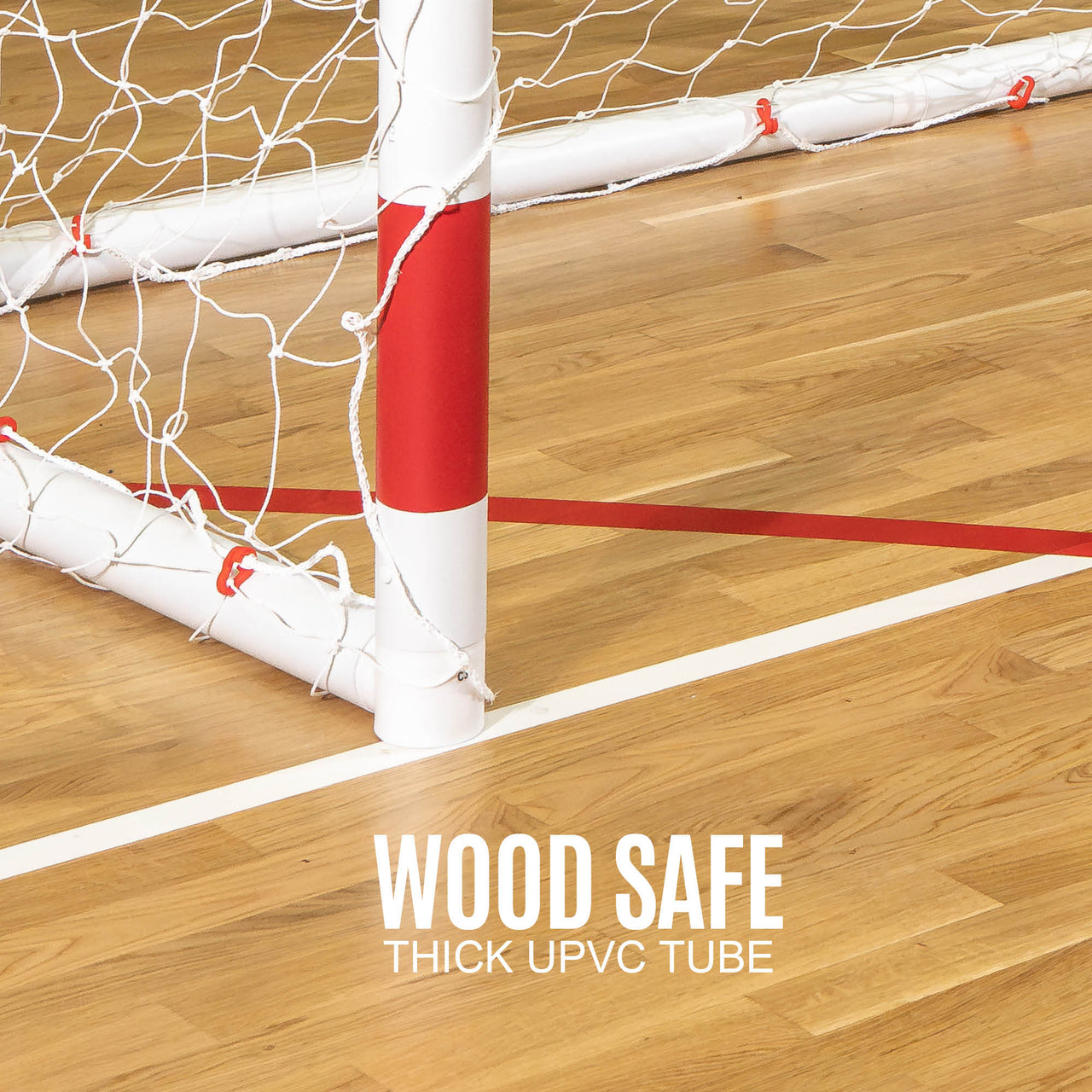 Wooden floor with a handball goal net and 'Wood Safe Thick UPVC Tube' text.