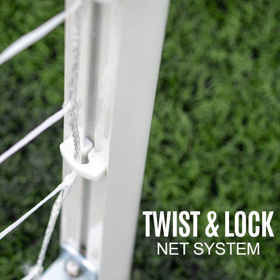 Close-up of a football goal with 'Twist & Lock Net System' text on a grass background
