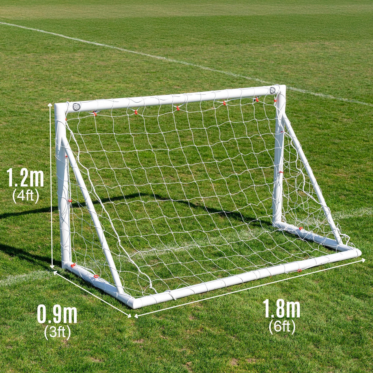 Q-FOLD 6x4' goal size chart on grass: 1.8m (6ft) wide, 1.2m (4ft) high and 0.9m (3ft) deep.