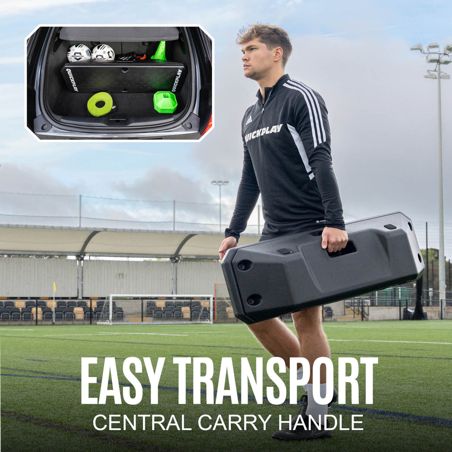Person holding a football rebounder with central carry handle on a sports field, inset showing the product in a car boot.