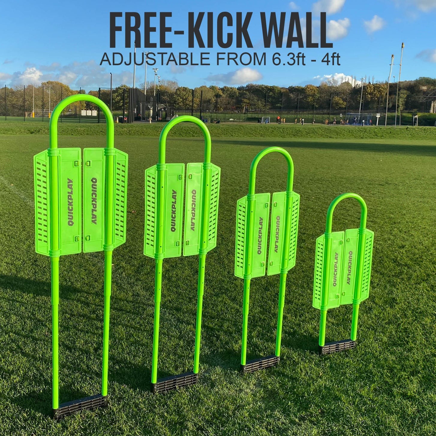 Four REPLAY Defender Mannequins set at different heights in a row on grass, with the text "Free-kick wall, adjustable from 6.3ft - 4ft".
