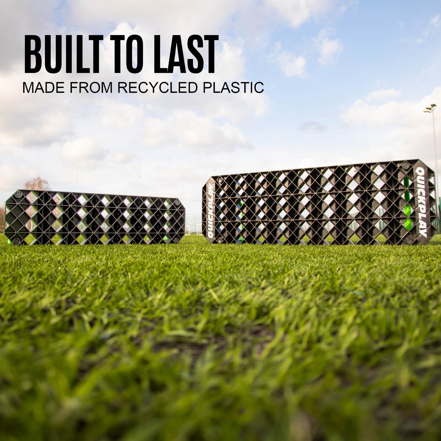Two REPLAY Station boards on grass, with the text "Built to last, made from recycled plastic".