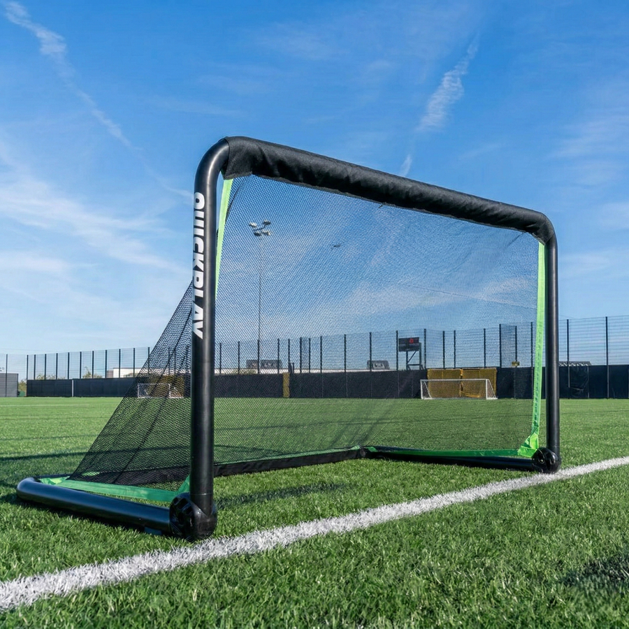 Portable rhino football goal on a grass field with a clear blue sky.
