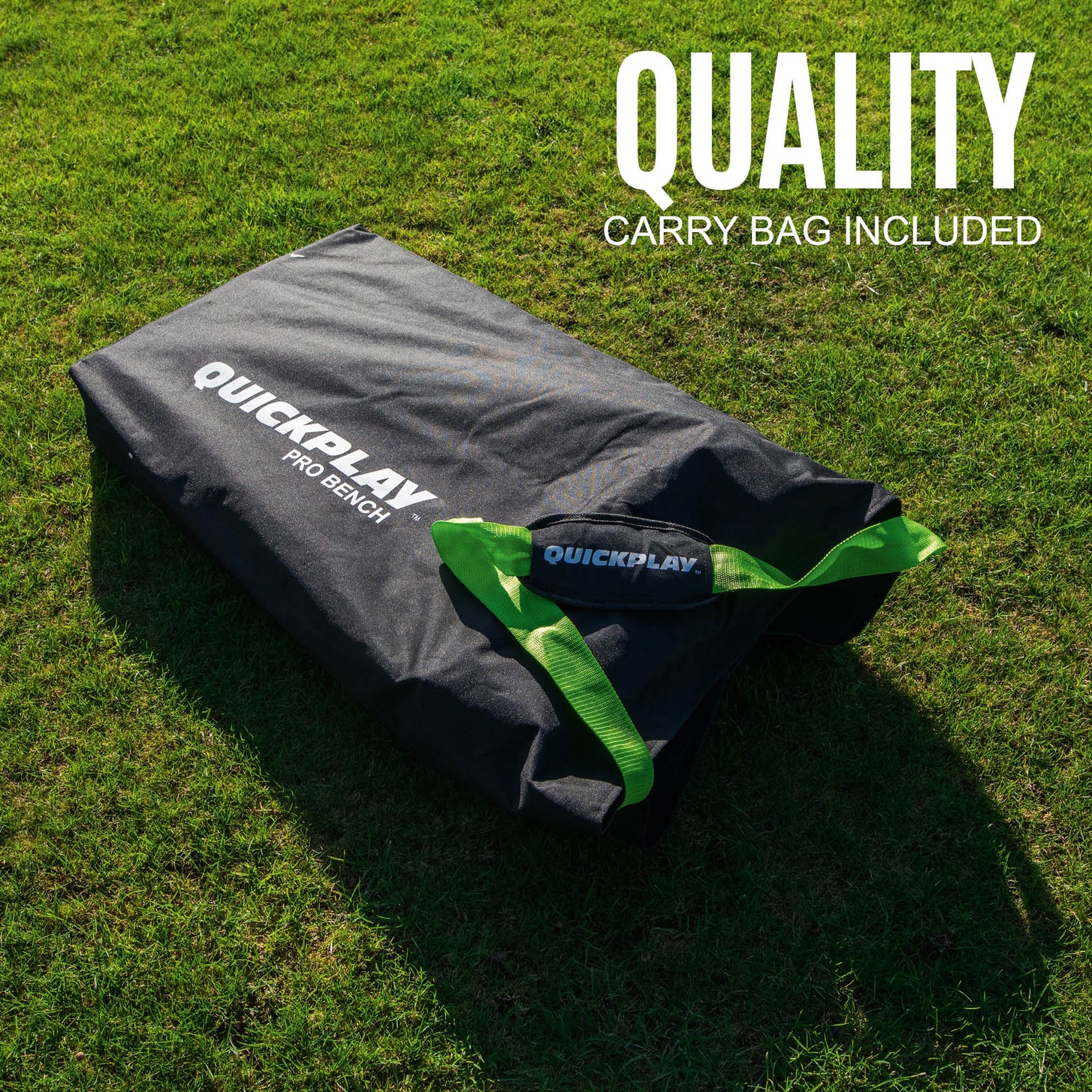 Black QUICKPLAY PRO Bench carry bag with green handles on grass, with the text "Quality carry bag included".