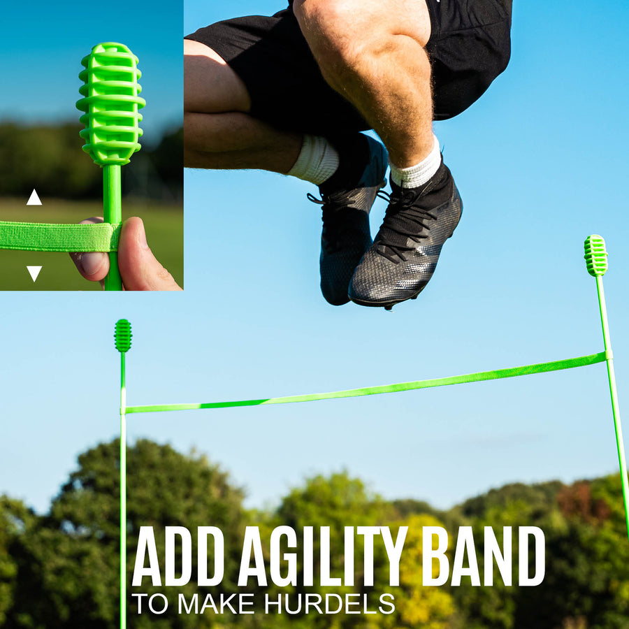 Person jumping over agility hurdles with a green band, set against a clear blue sky.
