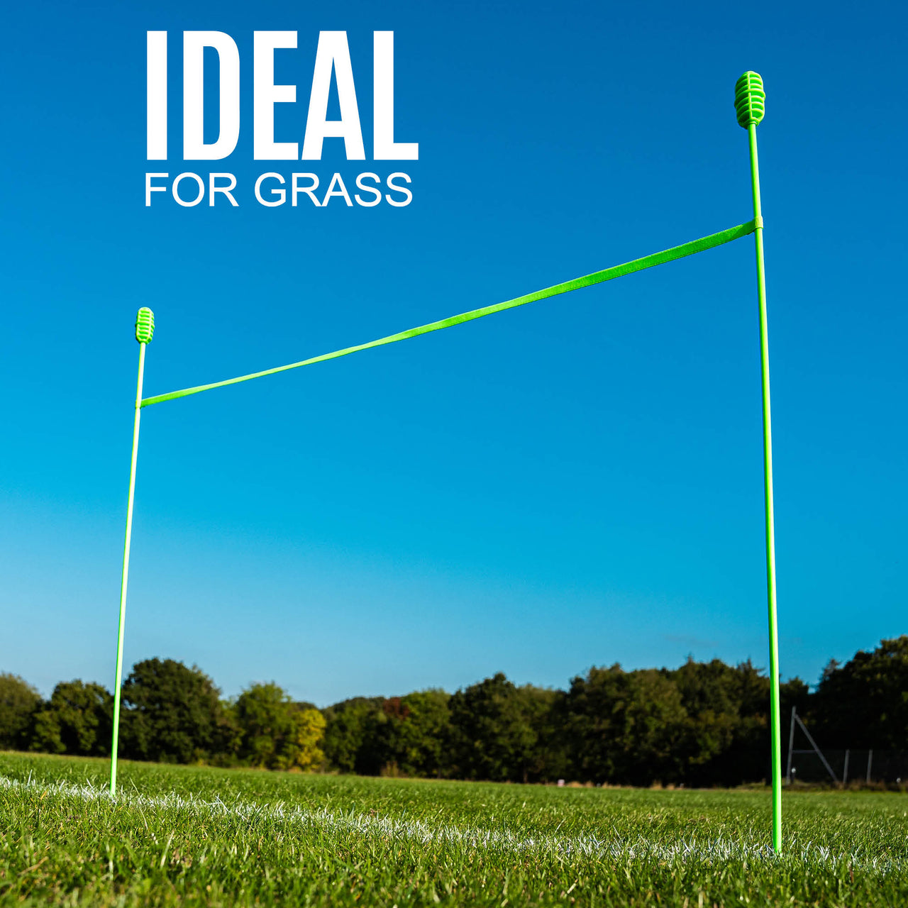 Green sports agility system on grass with clear blue sky and trees in the background, text 'IDEAL FOR GRASS' above.