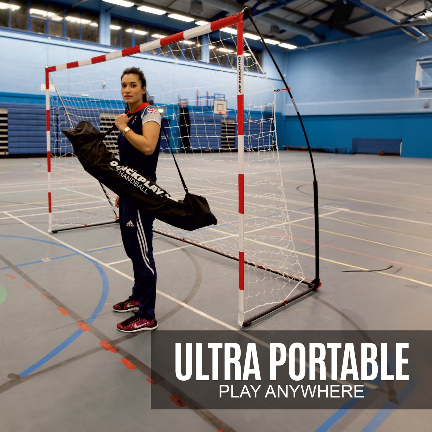Woman holding a black QUICKPLAY handball bag beside the Portable Handball Goal Adult 3x2m in a sports hall, with the text "Ultra portable".