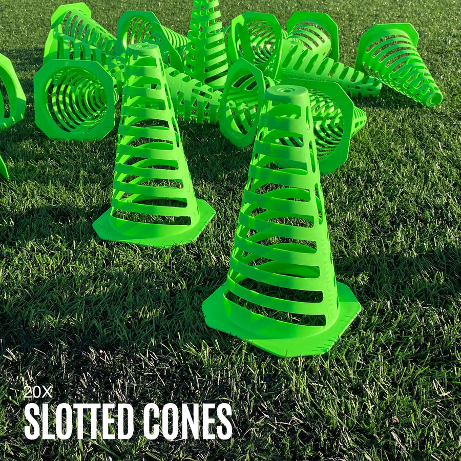 A pile of green PRO Speed & Agility Set slotted cones on artificial grass, with the text "20x slotted cones".