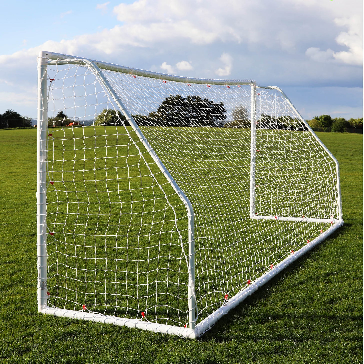 Q-FOLD Match 16x7' goal seen from the side, showing the net and rear frame on a grass field.