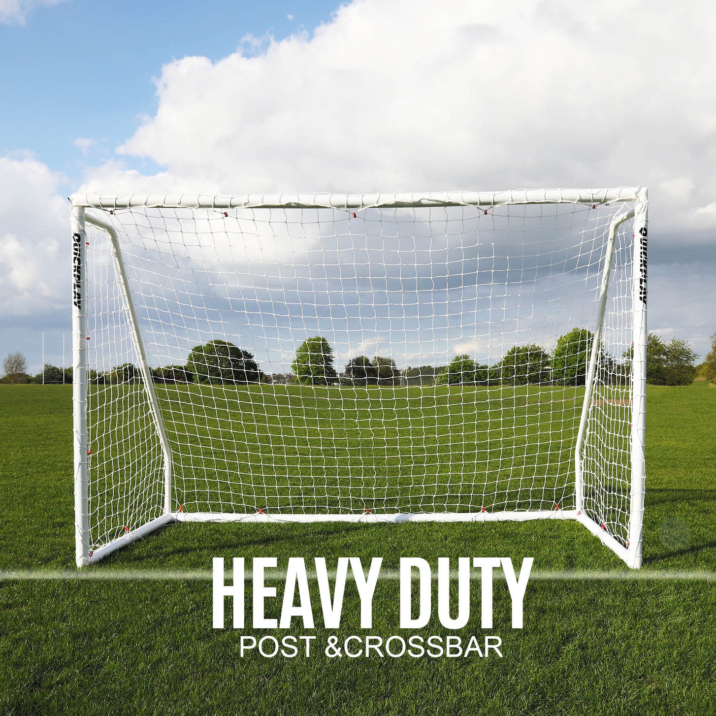 Q-FOLD Match 3x2m goal seen from the front on a grass field, with the text "Heavy duty post & crossbar".