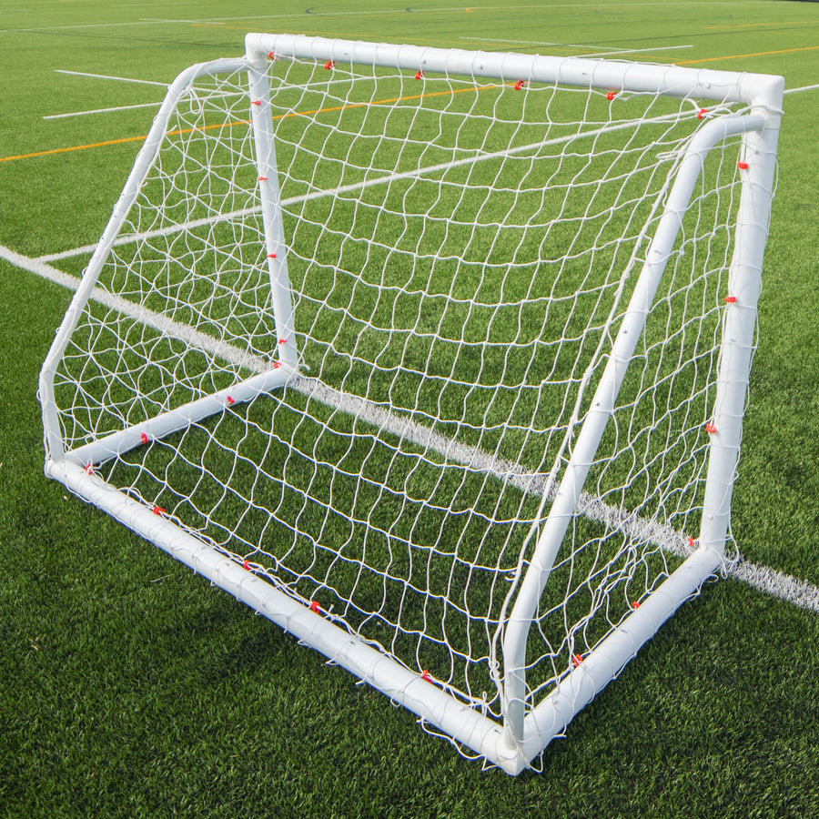 Q-FOLD Match 6x4' goal seen from behind on an artificial pitch with white and orange lines.