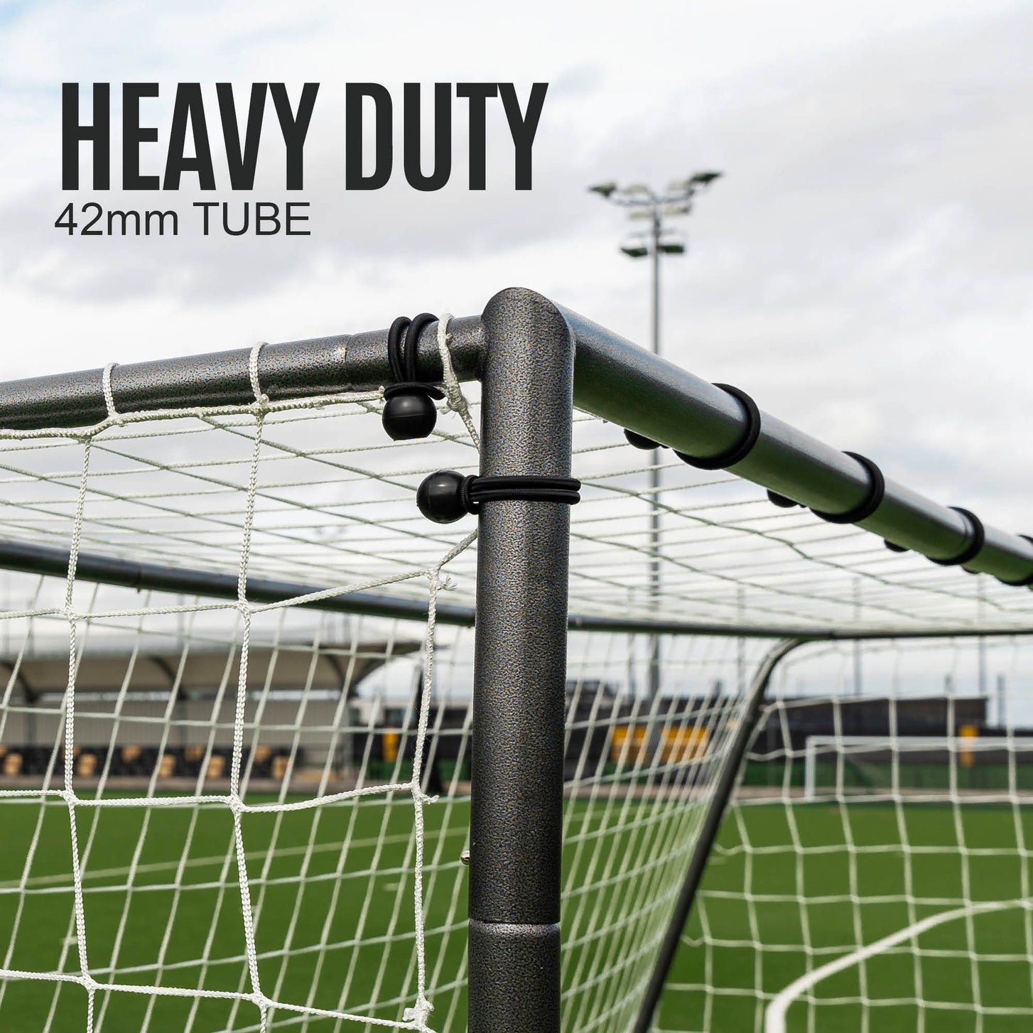 GS Series 16x7' goal top corner close up with net ties on the black frame, with the text "Heavy duty 42mm tube".