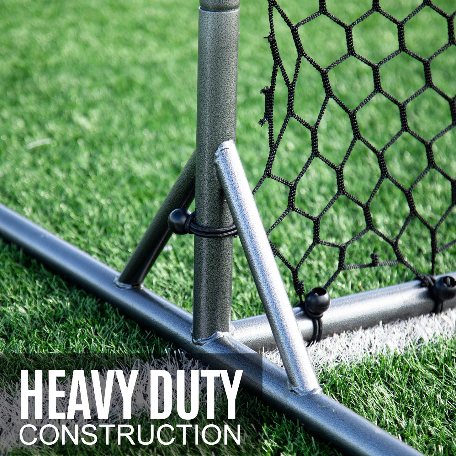 Barrier Net & Rebounder 12x6' foot and support strut close up on artificial grass, with the text "Heavy duty construction".