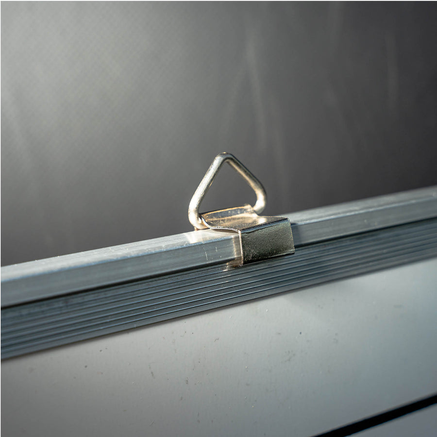Magnetic Whiteboard (LG) 60x90cm close up of a metal hanging loop on the aluminium frame.