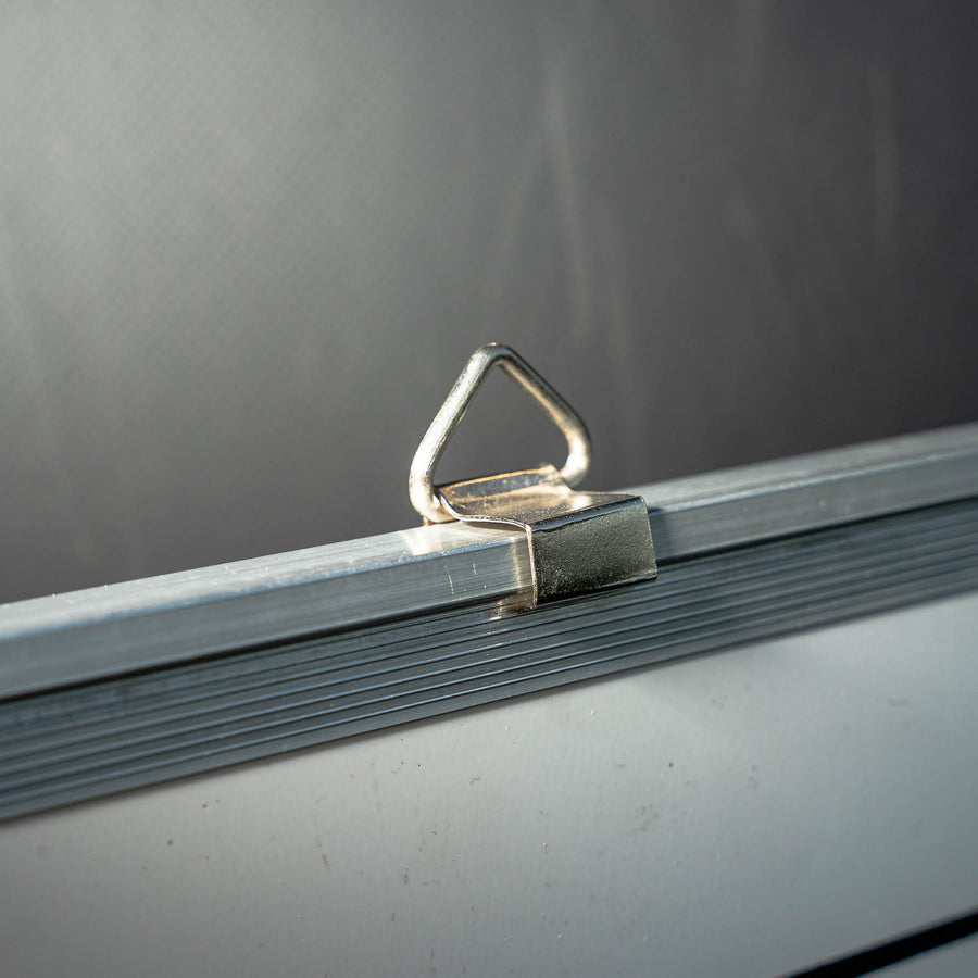 Magnetic Whiteboard (S) 30x45cm close up of a metal hanging loop on the aluminium frame.