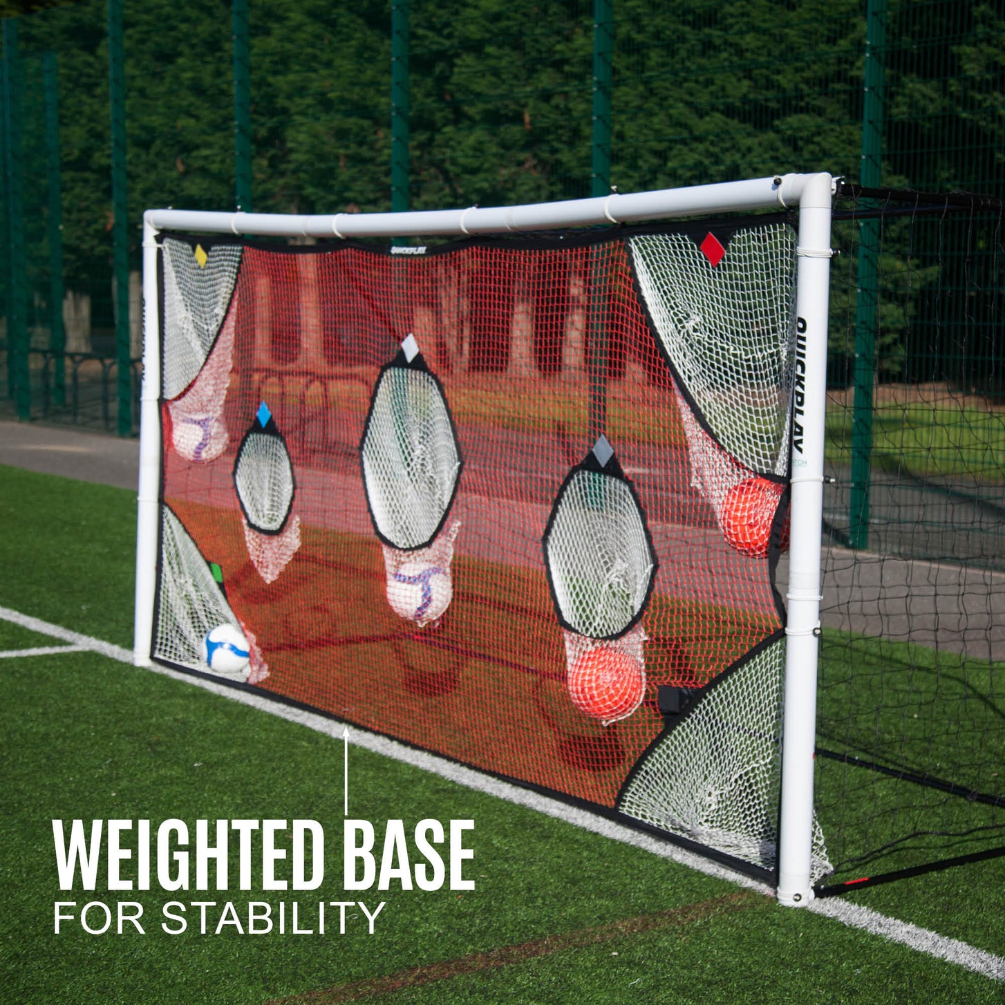 TARGET Net 12x6' with balls caught in its pockets on a white goal, with the text "Weighted base for stability".