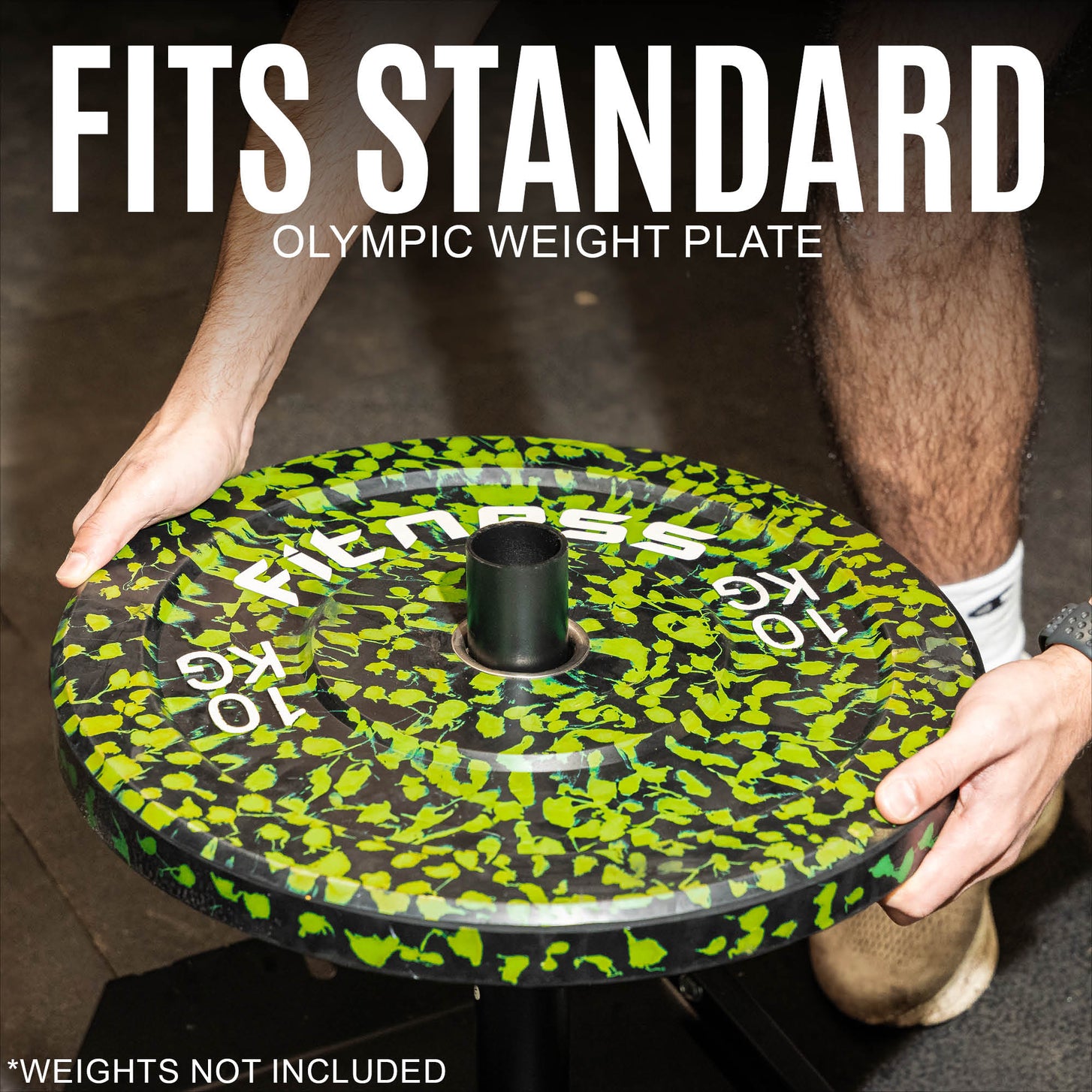 Hands sliding a weight plate onto the post of the Pull Speed Sled, with the text "Fits standard Olympic weight plate".