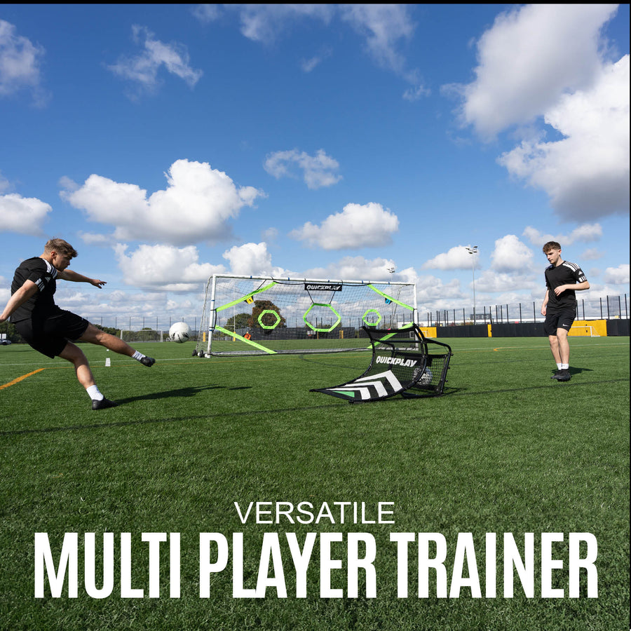 Two people playing with a football training device on a grass field with a clear sky.