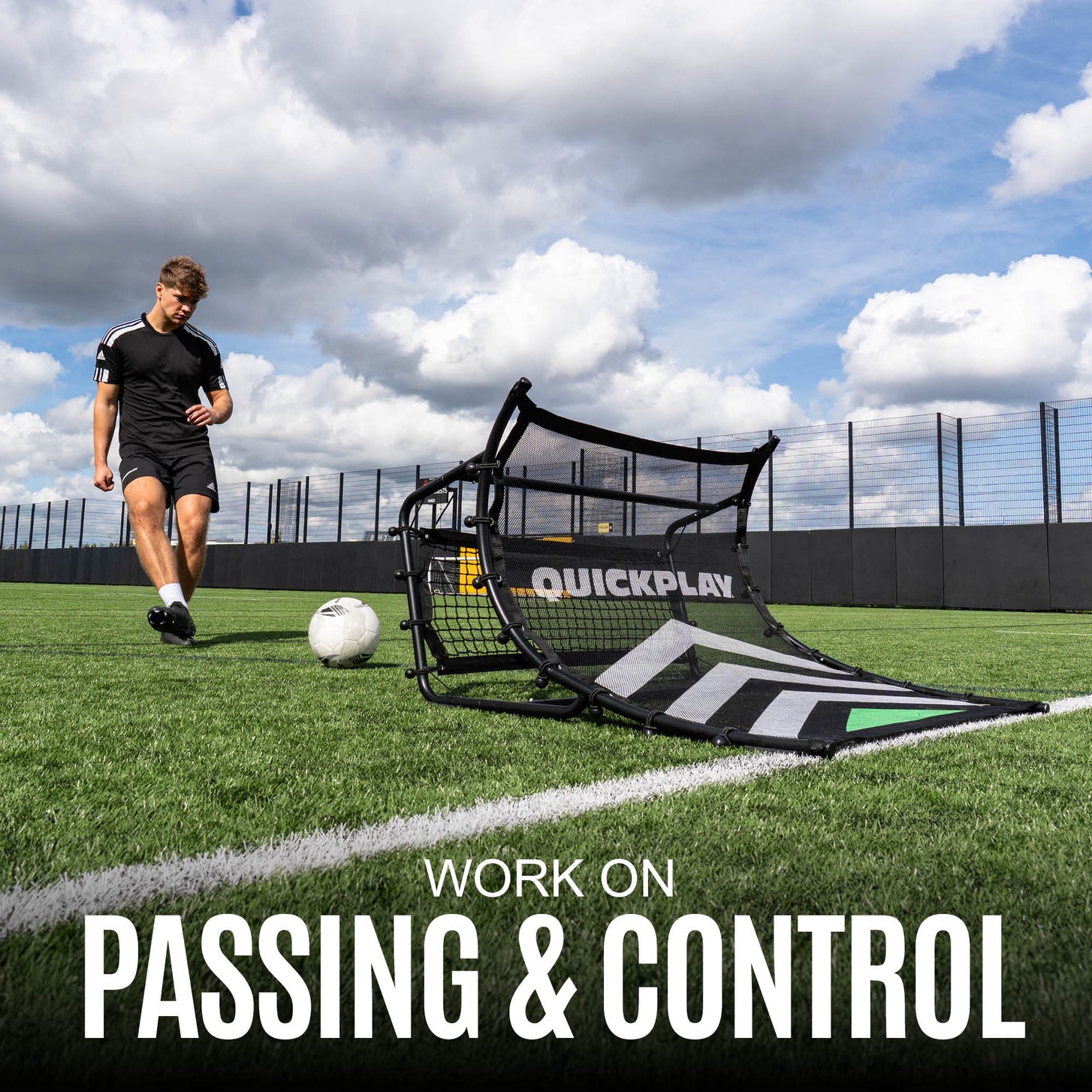 Person practicing football passing and control with a QuickPlay goal on a grass field.