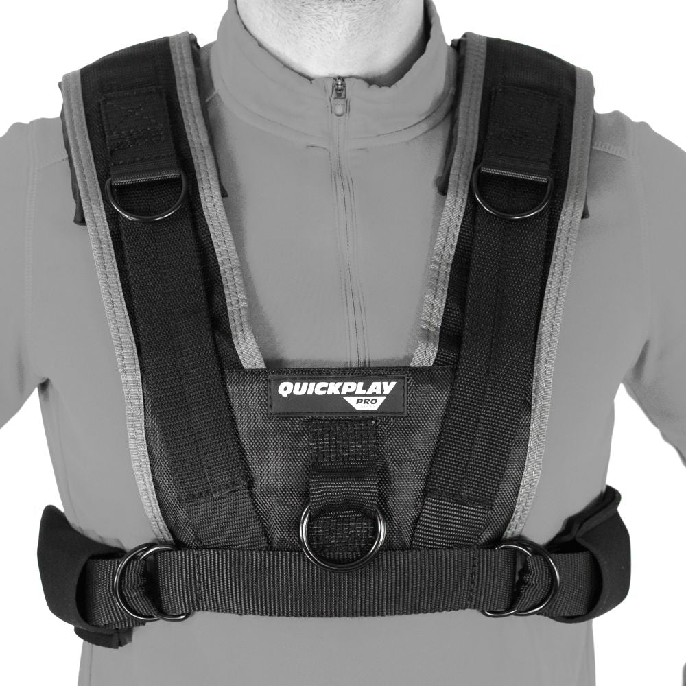 Utility Harness for Weight Sleds worn over a grey top, front view of the shoulder straps, D-rings and QUICKPLAY PRO chest panel.