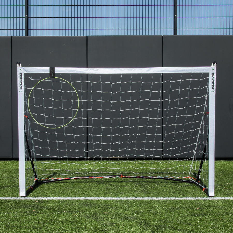 KICKSTER Football Target Ring in the top left corner of a white KICKSTER goal on an artificial pitch.