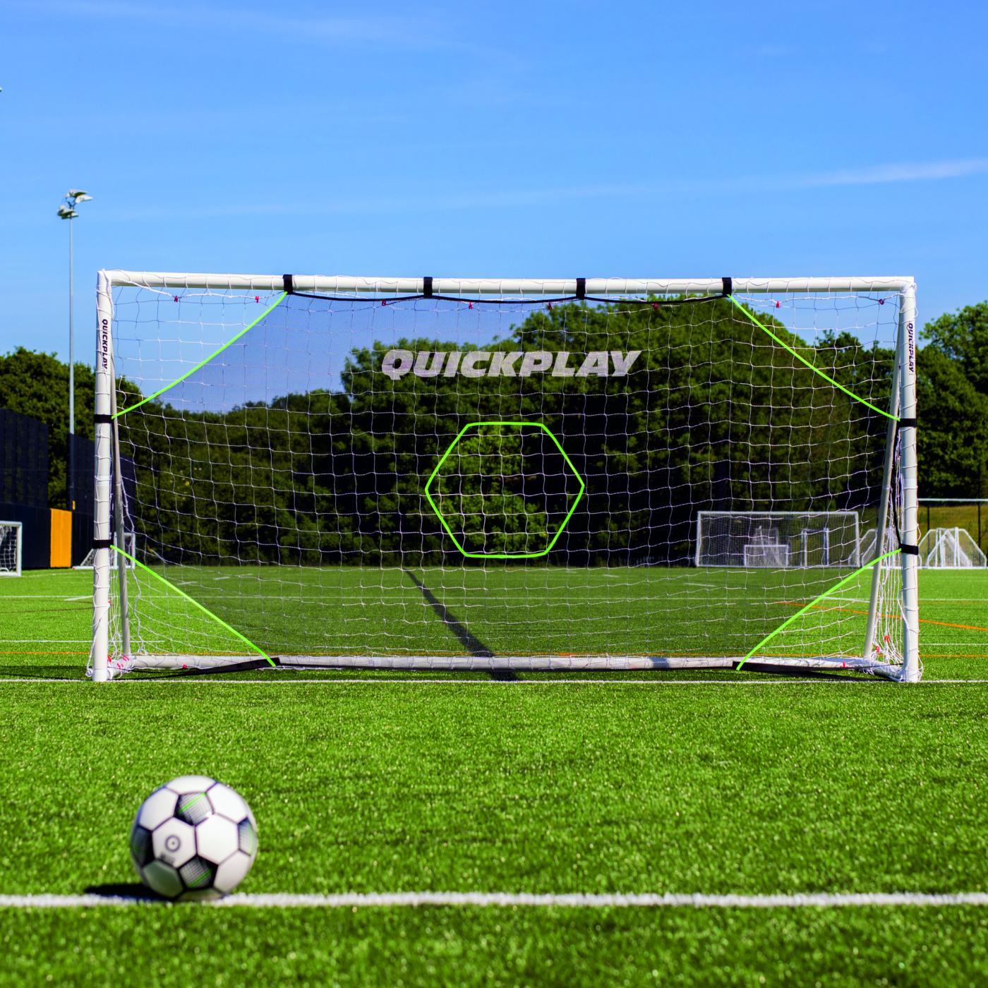 Front view of the TARGET Net Lite 6x4' on a white goal on an artificial pitch, with a ball in the foreground.