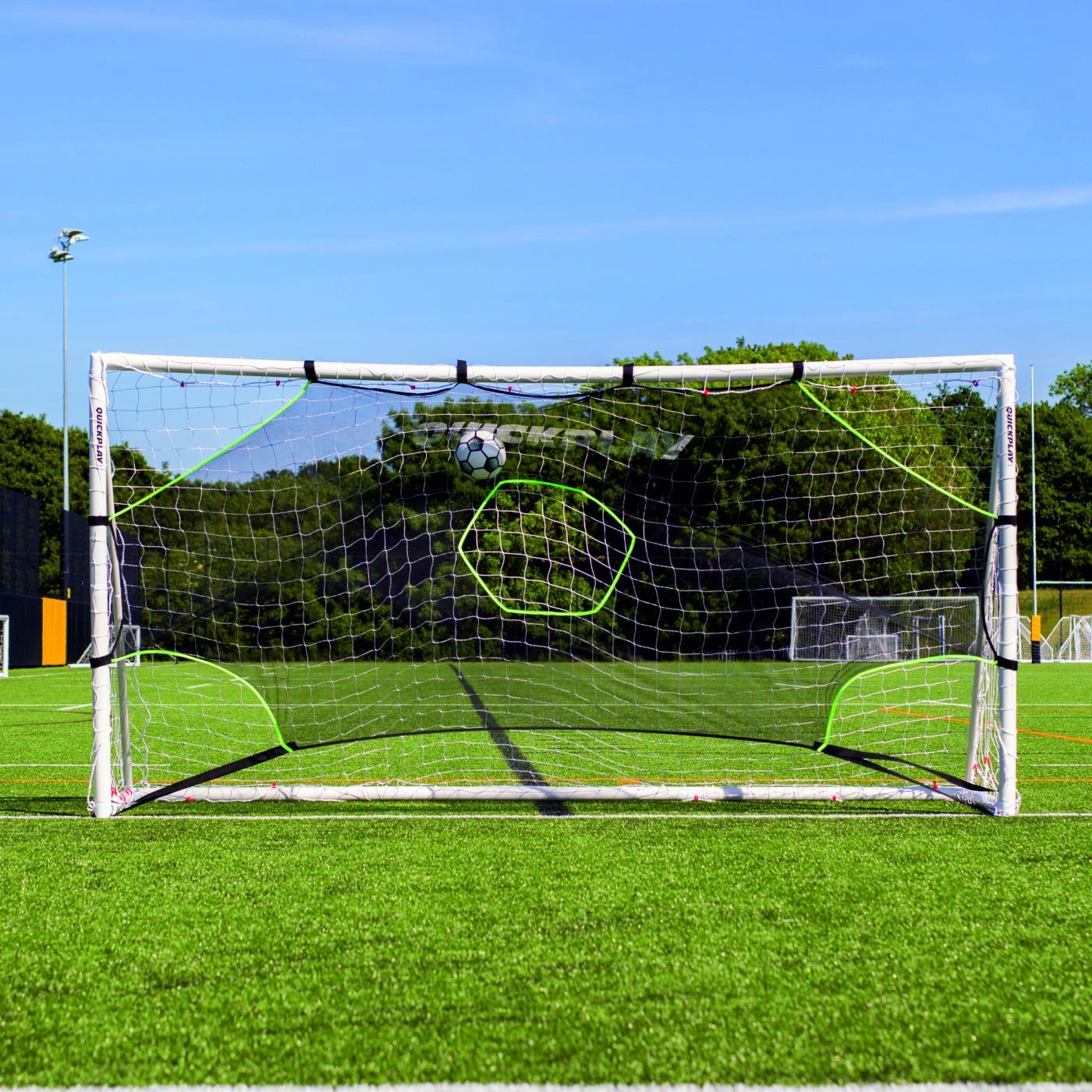 Ball in flight above the hexagon hole of the TARGET Net Lite 16x7', with the bottom corners of the goal left open.