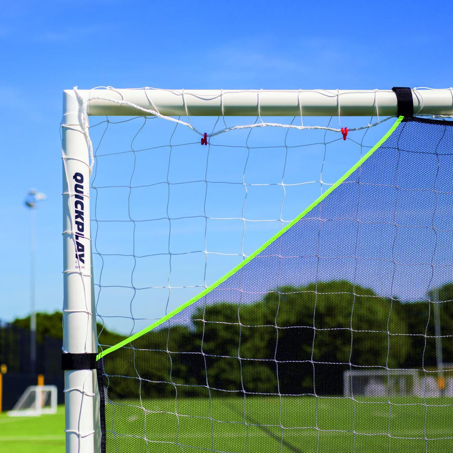 Close-up of the TARGET Net Lite 16x7' top corner, with its green edge and black strap on a white QUICKPLAY goal.